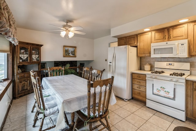 1243 W Byron Ave, Addison, IL 60101 - kitchen featuring white appliances, light tile patterned floors, ceiling fan, decorative backsplash, and light countertops