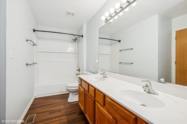 955 S Roxbury Ct, Round Lake, IL 60073 - bathroom featuring double vanity, shower / tub combination, and wood finished floors