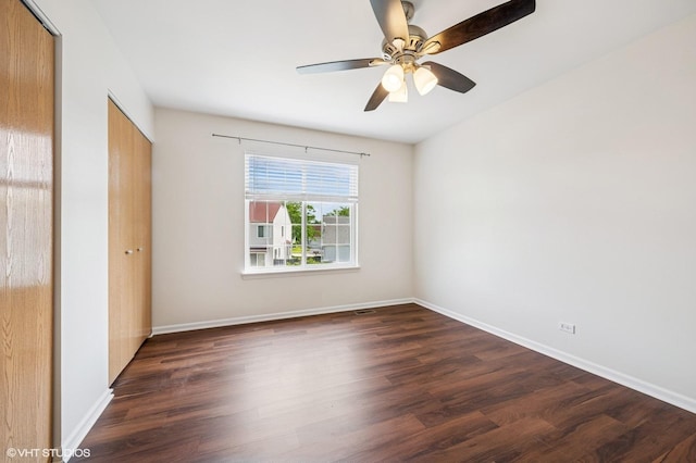955 S Roxbury Ct, Round Lake, IL 60073 - unfurnished bedroom featuring dark wood-style floors, a closet, and a ceiling fan