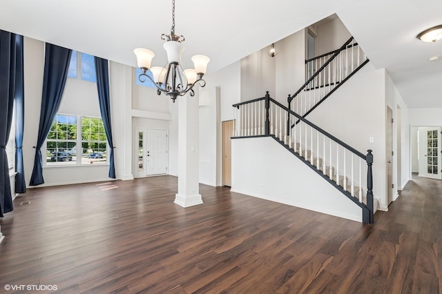 955 S Roxbury Ct, Round Lake, IL 60073 - foyer featuring wood finished floors, a chandelier, stairs, and a high ceiling
