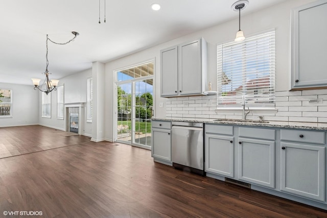 955 S Roxbury Ct, Round Lake, IL 60073 - kitchen featuring stainless steel dishwasher, gray cabinetry, plenty of natural light, and a chandelier
