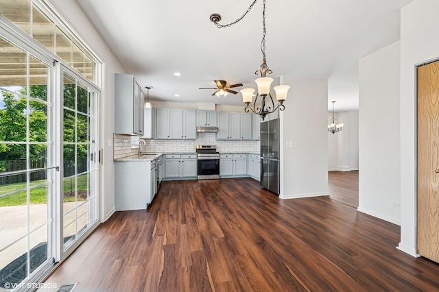 955 S Roxbury Ct, Round Lake, IL 60073 - kitchen with a chandelier, stainless steel stove, decorative backsplash, gray cabinetry, and dark wood-style floors