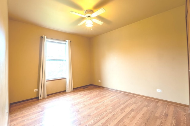 1413 N Metropolitan Ave, Waukegan, IL 60085 - unfurnished room with ceiling fan, light wood finished floors, and baseboards