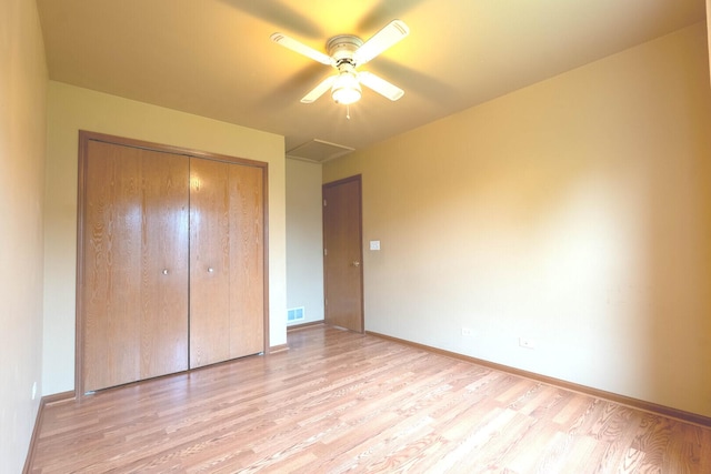 1413 N Metropolitan Ave, Waukegan, IL 60085 - unfurnished bedroom with light wood finished floors, a closet, baseboards, and ceiling fan