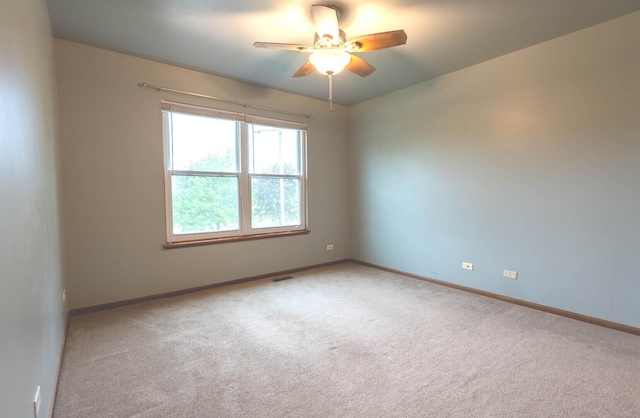 1413 N Metropolitan Ave, Waukegan, IL 60085 - empty room featuring ceiling fan, carpet floors, and baseboards