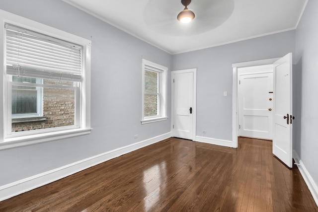 6210 N Francisco Ave, Chicago, IL 60659 - unfurnished bedroom with dark wood-type flooring, baseboards, crown molding, and a ceiling fan