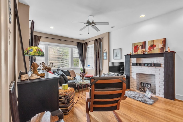6210 N Francisco Ave, Chicago, IL 60659 - living room featuring a brick fireplace, wood finished floors, ceiling fan, and recessed lighting