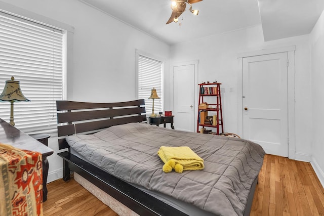 6210 N Francisco Ave, Chicago, IL 60659 - bedroom featuring wood finished floors, a ceiling fan, and baseboards