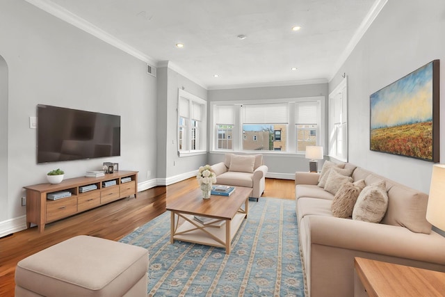 6210 N Francisco Ave, Chicago, IL 60659 - living area featuring crown molding, wood finished floors, baseboards, recessed lighting, and arched walkways