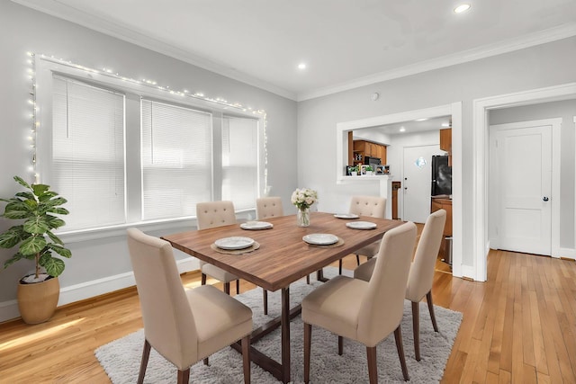 6210 N Francisco Ave, Chicago, IL 60659 - dining space with light wood-style floors, crown molding, recessed lighting, and baseboards