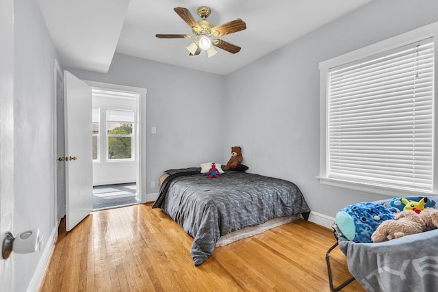 6210 N Francisco Ave, Chicago, IL 60659 - bedroom featuring baseboards, wood-type flooring, and a ceiling fan
