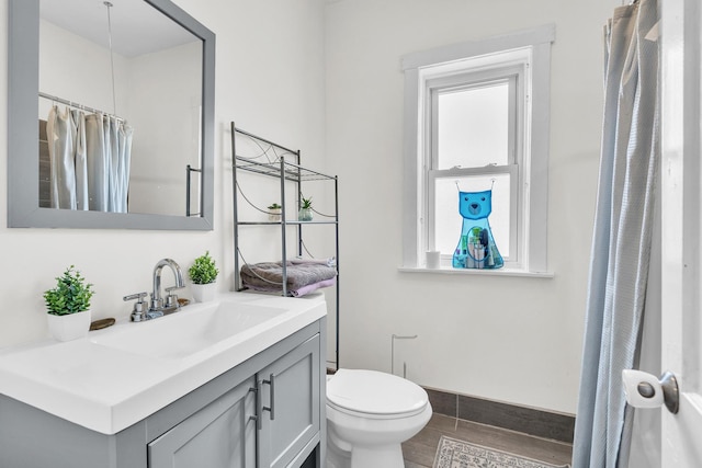 6210 N Francisco Ave, Chicago, IL 60659 - bathroom with vanity, toilet, plenty of natural light, and a shower with shower curtain