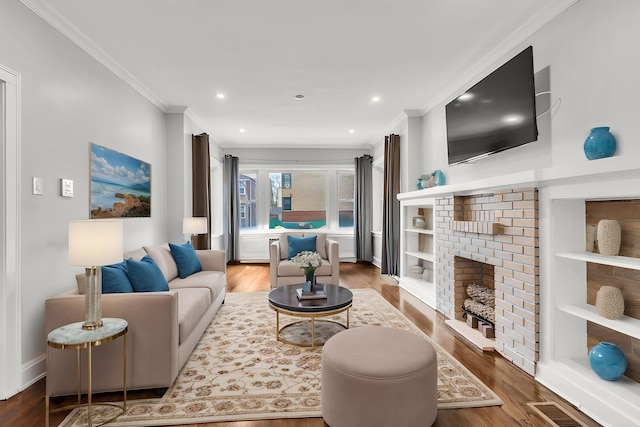 6210 N Francisco Ave, Chicago, IL 60659 - living room featuring ornamental molding, wood finished floors, recessed lighting, and a brick fireplace