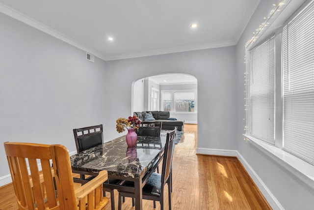 6210 N Francisco Ave, Chicago, IL 60659 - dining room with arched walkways, light wood finished floors, ornamental molding, baseboards, and recessed lighting