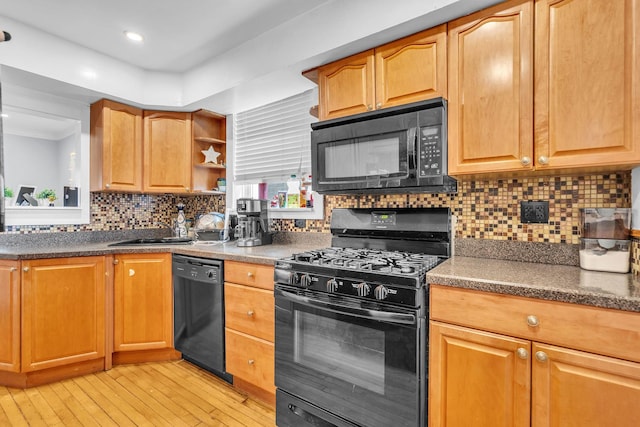 6210 N Francisco Ave, Chicago, IL 60659 - kitchen featuring black appliances, light wood-style floors, open shelves, tasteful backsplash, and dark countertops