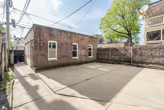 6210 N Francisco Ave, Chicago, IL 60659 - rear view of property with brick siding and a patio