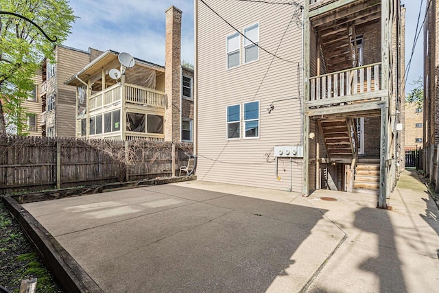 6210 N Francisco Ave, Chicago, IL 60659 - rear view of house featuring a balcony and a patio