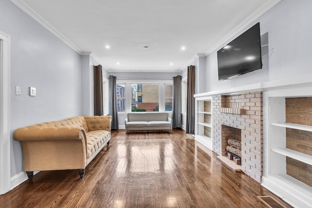 6210 N Francisco Ave, Chicago, IL 60659 - living area featuring dark wood-style floors, ornamental molding, baseboards, recessed lighting, and a fireplace