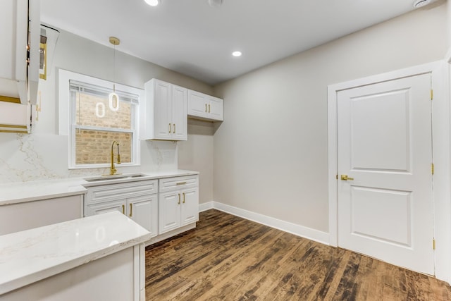 5544 S California Ave, Chicago, IL 60629 - kitchen featuring a sink, white cabinetry, pendant lighting, dark wood-type flooring, and recessed lighting