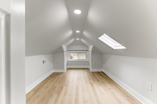 5544 S California Ave, Chicago, IL 60629 - additional living space with recessed lighting, a skylight, wood finished floors, lofted ceiling, and baseboards