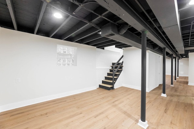 5544 S California Ave, Chicago, IL 60629 - finished basement with baseboards, stairs, and wood finished floors