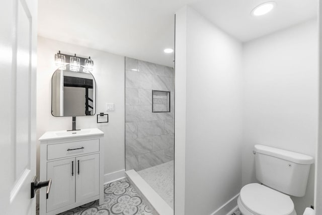 5544 S California Ave, Chicago, IL 60629 - bathroom featuring toilet, a walk in shower, baseboards, vanity, and recessed lighting