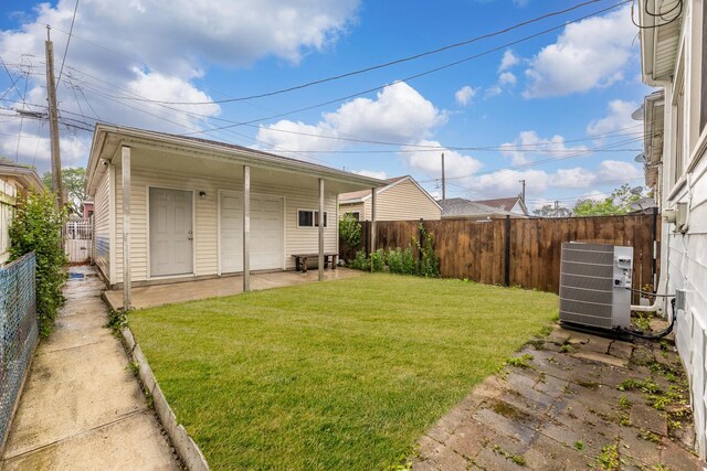 5544 S California Ave, Chicago, IL 60629 - view of yard with central air condition unit and a patio