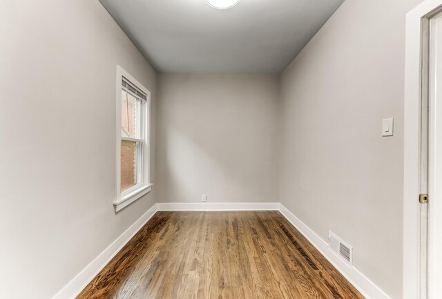 5544 S California Ave, Chicago, IL 60629 - spare room featuring dark wood finished floors and baseboards