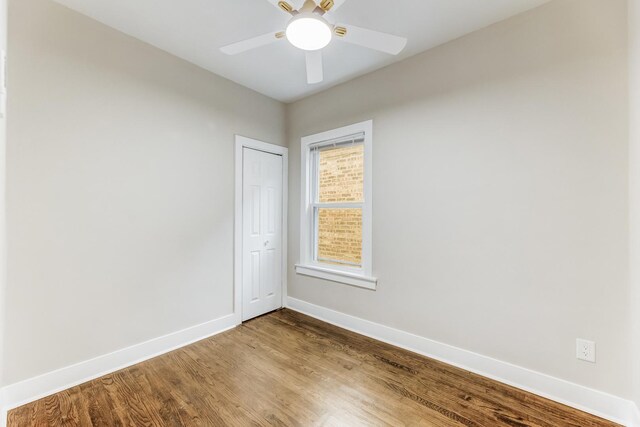 5544 S California Ave, Chicago, IL 60629 - empty room with baseboards, wood finished floors, and ceiling fan