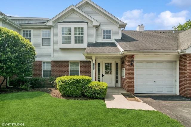 1727 W Hawkes St Unit 7, Arlington Heights, IL 60004 - view of front facade featuring brick siding, an attached garage, a front yard, a chimney, and a shingled roof
