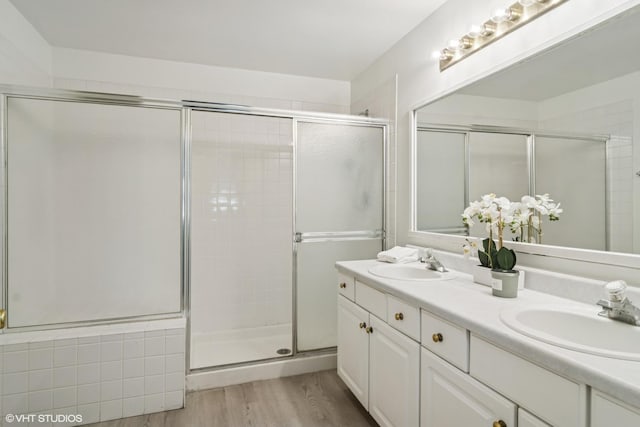 1727 W Hawkes St Unit 7, Arlington Heights, IL 60004 - full bathroom with double vanity, a shower stall, and wood finished floors