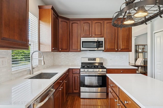 4370 Whitehall Ln, Algonquin, IL 60102 - kitchen featuring stainless steel appliances, wood finished floors, plenty of natural light, and light countertops