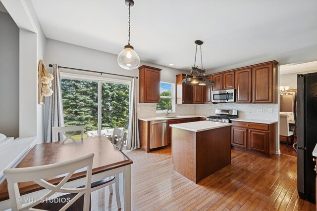 4370 Whitehall Ln, Algonquin, IL 60102 - kitchen featuring stainless steel appliances, light countertops, tasteful backsplash, and a kitchen island