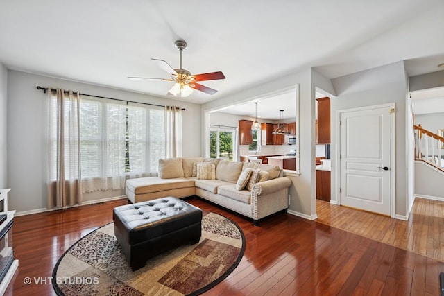 4370 Whitehall Ln, Algonquin, IL 60102 - living room featuring dark wood finished floors, a ceiling fan, and stairway