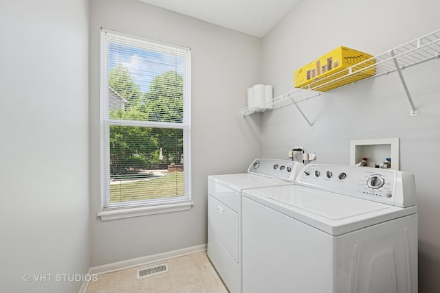 4370 Whitehall Ln, Algonquin, IL 60102 - laundry room with washing machine and dryer, plenty of natural light, and light tile patterned flooring