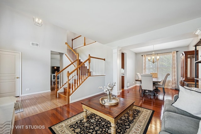 4370 Whitehall Ln, Algonquin, IL 60102 - living room with a chandelier, wood-type flooring, and stairway