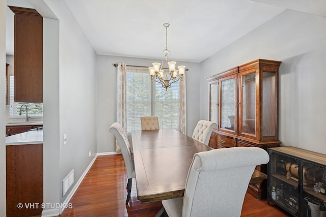 4370 Whitehall Ln, Algonquin, IL 60102 - dining room with a chandelier and dark wood-style floors