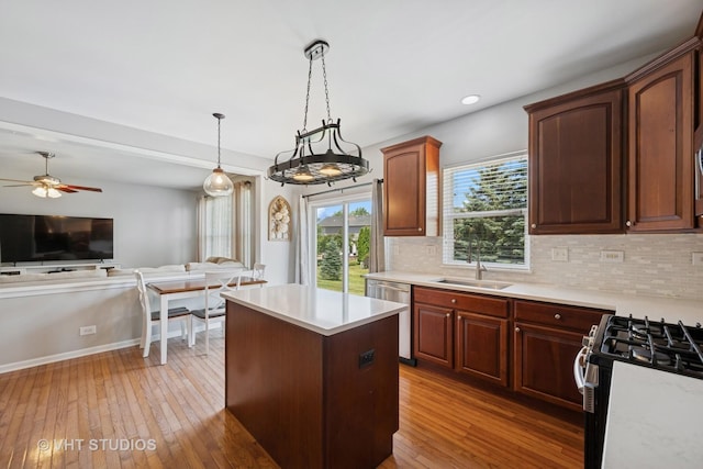 4370 Whitehall Ln, Algonquin, IL 60102 - kitchen featuring dishwasher, light countertops, open floor plan, backsplash, and light wood-style flooring