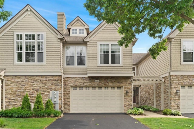 365 Lake Ave Unit D, Wauconda, IL 60084 - multi unit property featuring stone siding, driveway, and a garage