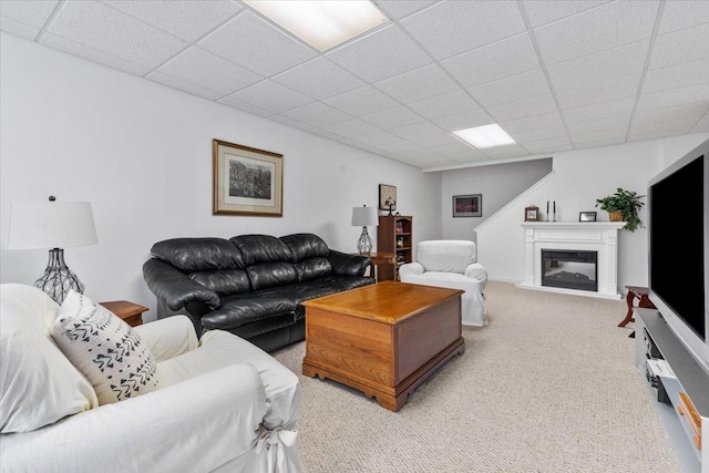 365 Lake Ave Unit D, Wauconda, IL 60084 - living room featuring light colored carpet, a glass covered fireplace, and a drop ceiling