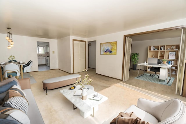 7202 W Wrightwood Ave Unit 2S, Elmwood Park, IL 60707 - living room featuring carpet flooring, a desk, and baseboards