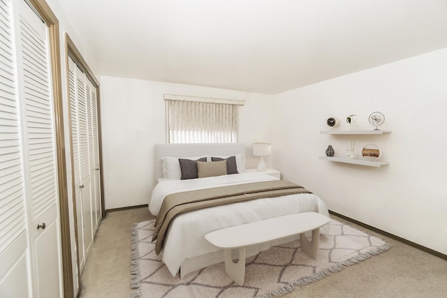 7202 W Wrightwood Ave Unit 2S, Elmwood Park, IL 60707 - bedroom featuring light carpet, baseboards, and two closets