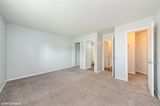 527 E Shagbark Ln Unit H, Streamwood, IL 60107 - unfurnished bedroom featuring light carpet and a closet