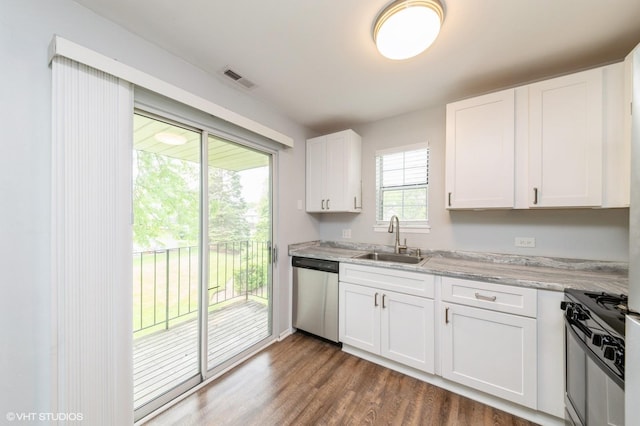 527 E Shagbark Ln Unit H, Streamwood, IL 60107 - kitchen featuring stainless steel appliances, white cabinetry, dark wood-style floors, and light stone counters