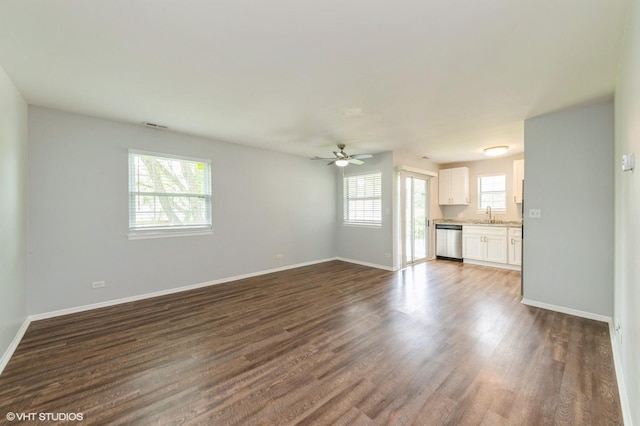 527 E Shagbark Ln Unit H, Streamwood, IL 60107 - unfurnished living room with a ceiling fan and dark wood-style floors