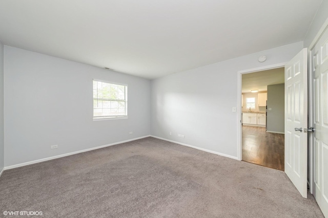 527 E Shagbark Ln Unit H, Streamwood, IL 60107 - unfurnished room featuring carpet and a smoke detector