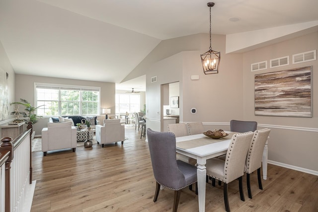 26615 W Captiva Ln, Plainfield, IL 60544 - dining room with a chandelier, lofted ceiling, and light wood finished floors