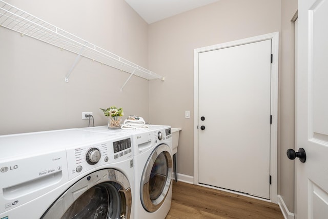 26615 W Captiva Ln, Plainfield, IL 60544 - laundry room with independent washer and dryer, light wood-type flooring, and baseboards
