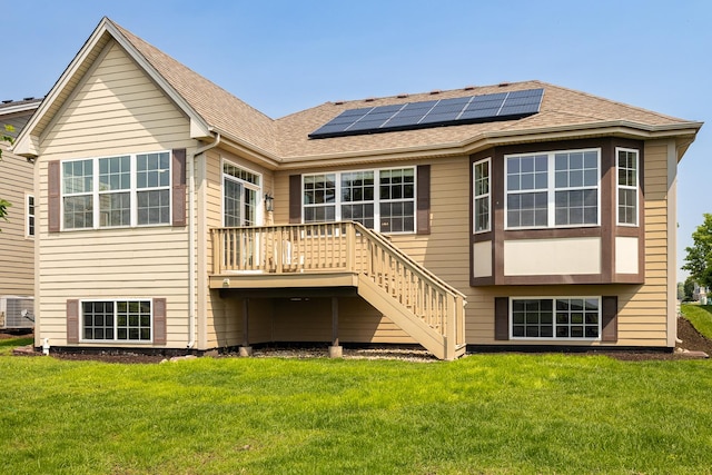 26615 W Captiva Ln, Plainfield, IL 60544 - rear view of property featuring roof mounted solar panels, a lawn, stairway, a deck, and roof with shingles