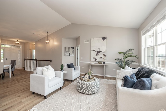 26615 W Captiva Ln, Plainfield, IL 60544 - living area featuring light wood-style flooring, lofted ceiling, and baseboards